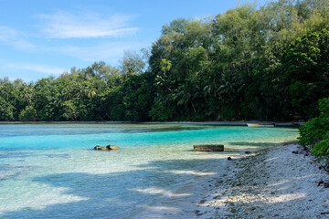 Stunning quiet cove with crystal clear turquoise ocean on a remote tropical island in the Solomon Islands 