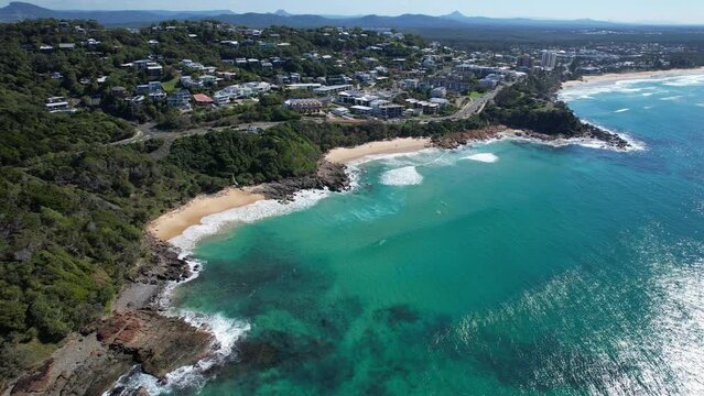 Sea Waves By The Coastal Town In Coolum Beach In Sunshine Coast, Noosa Region, QLD Australia. Aerial Drone Shot