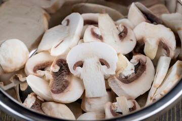 sliced mushrooms during cooking dishes with champignons