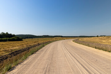 Fototapeta na wymiar Rural road for cars and transport