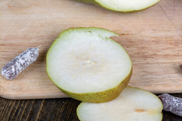 delicious and ripe pear on a wooden board