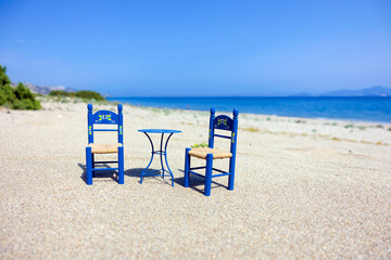 greek beach with greek style table and chairs