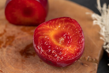 cut into pieces of plums in flavored pink yogurt