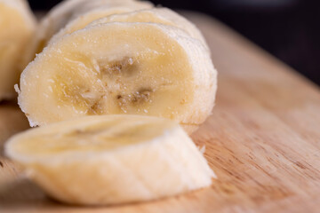 Sliced ripe banana on a cutting board