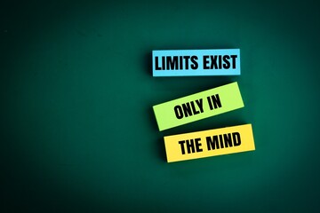 colored paper with the words of the quote Limits exist only in the mind. motivational and...