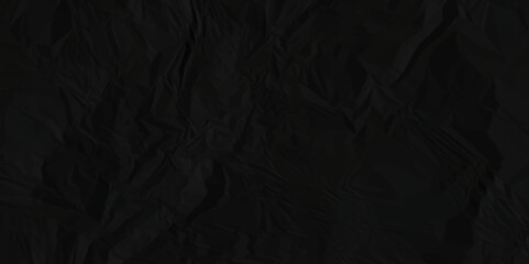 Black crumpled paper. Crumpled paper texture background. Rough and textured in black paper. The textures can be used for background of text or any contents.