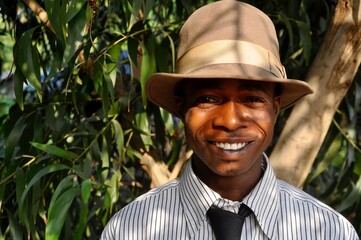 Smiling young man wearing a hat