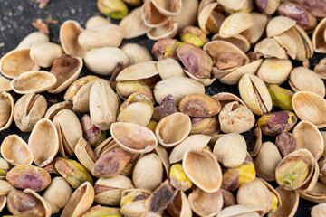 a large number of salty and crispy pistachios close-up