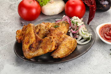 Grilled chicken wings with sauce