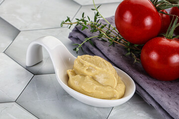 Dijon mustard sauce in the bowl