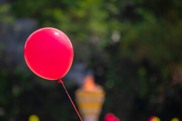 Red balloon flying close up image