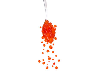 red fish caviar in a spoon and eggs falling down, isolated on white