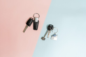 Keys from car and house on two colored background