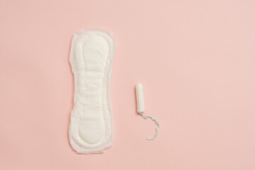 Feminine sanitary napkin (sanitary pad) with tampon on pink background - obrazy, fototapety, plakaty