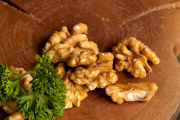 Peeled walnut on a board with parsley