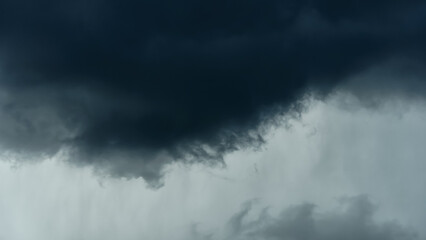 Fototapeta premium storm sky, dark dramatic clouds during thunderstorm, rain and wind, extreme weather, abstract background