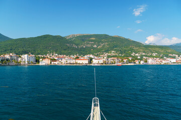 sea cruise along the Bay of Kotor in Montenegro, arrival at the port of Tivat city, beautiful views of nature and mountains, summer travel concept