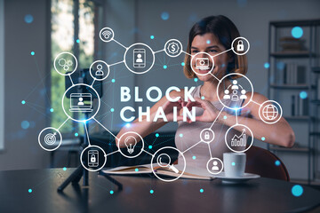 Happy woman is making video blog using smartphone on a tripod explaining with hands at office workplace. Concept of online stream, business education, conference call. Blockchain hologram