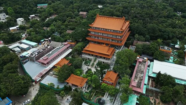 Aerial around the Po Lin Monastery on Lantau Island, Hong Kong, China. Drone orbit shot