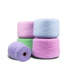 composition of bobbins with woolen threads, yarn for knitting close-up on a white background