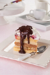 Somloi galuska is a Hungarian dessert made with three sponge cakes of different flavors.