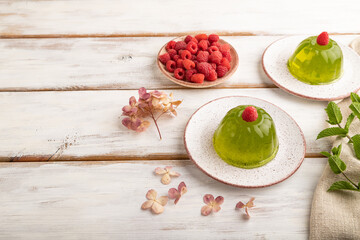 Mint and raspberry jelly on white wooden. side view, copy space.