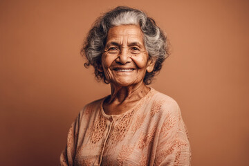 Cheerful old Latin woman smiling in studio. Generative AI.