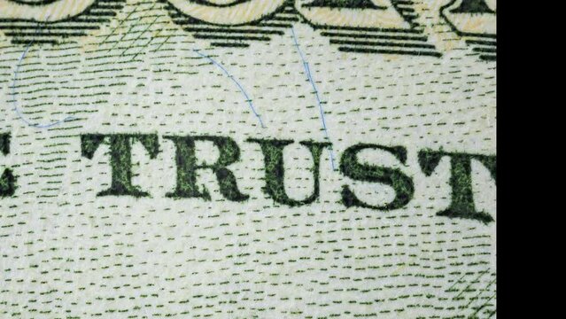 Close-up shot of various parts of a fifty dollar bill