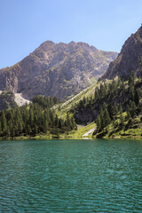 Vertical Scenery of Rocky Mountain in Summer Austria. Lanscape of Travel Destination with Green Alpine Lake in Europe.