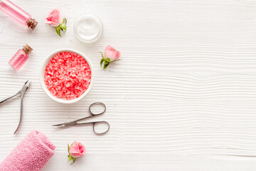Pink roses flowers and manicure tools. Beauty nail care spa salon.