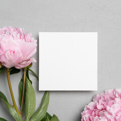 Blank square paper card mockup with pink peony flowers, white card mock up with copy space