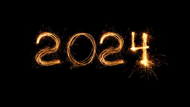 New Year 2024 light. Sparklers draw figures 2024. Bengal lights and letter. Holidays. Luxury