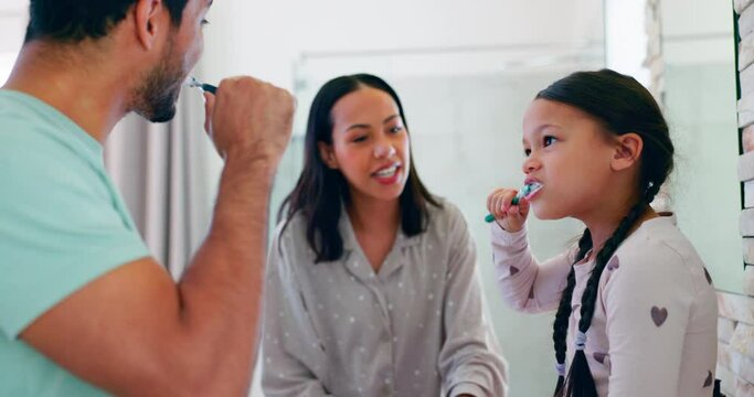 Bathroom, parents and teach a kid about brushing teeth in the morning for healthy habit in home. Child, learning and family with toothbrush for oral care with support for fresh breath and wellness.
