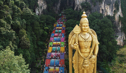 Batu Caves temple aerial view and the giant Murugan statue, Hindu God of war, in Kuala Lumpur,...