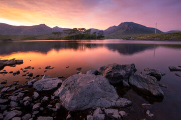 Landscape. Mountains of Connemara National Park from Derryclare lough at sunset. Galway. Ireland