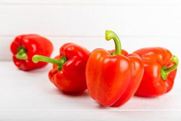 PAPRIKA.Fresh whole red bell pepper on a light textured background. Bulgarian salad pepper .Fresh vegetables. Harvest. Vegan. close up