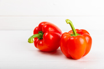 PAPRIKA.Fresh whole red bell pepper on a light textured background. Bulgarian salad pepper .Fresh vegetables. Harvest. Vegan. close up