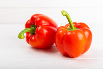 PAPRIKA.Fresh whole red bell pepper on a light textured background. Bulgarian salad pepper .Fresh vegetables. Harvest. Vegan. close up