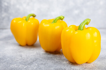 PAPRIKA.Fresh yellow bell pepper on light textural background. Bulgarian salad pepper .Fresh vegetables. Harvest. Vegan. close up