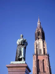 Deurstickers Statue of the Dutch lawyer Hugo Grotius  (Hugo de Groot) in front of the New Church © robepco