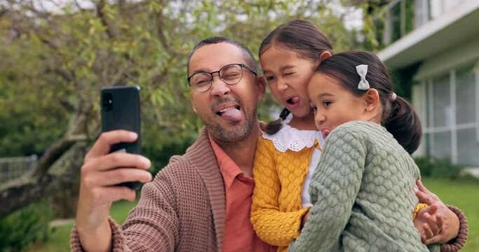 Family, silly face and outdoor for a selfie in a backyard with tongue out, happiness and love. A happy man or dad and girl kids together for social media profile picture, quality time and bonding