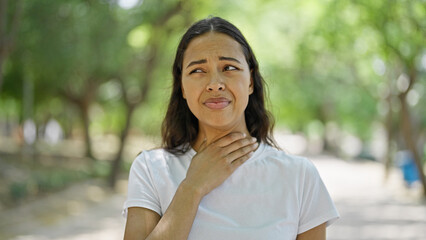 African american woman suffering for throat pain at park