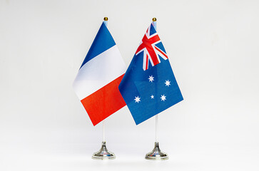 State flags of France and Australia on a light background.