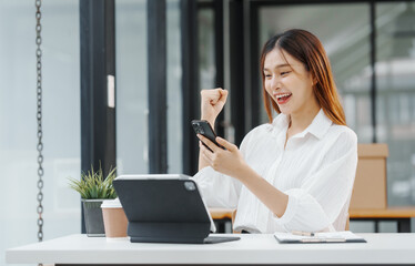 Excited Female secretary business woman in South Korean workplaces, feeling euphoric celebration...