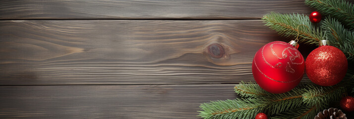 Fototapeta na wymiar Conifer branch, cone and christmas decorations on wooden background with copy space