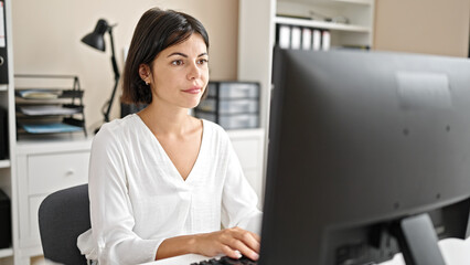 Young beautiful hispanic woman business worker using computer working at office