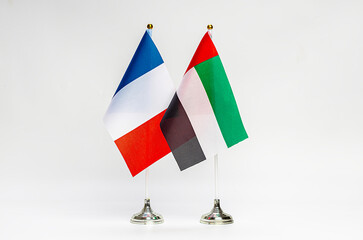State flags of France and United Arab Emirates on a light background.