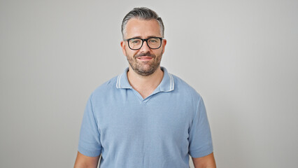 Grey-haired man smiling confident wearing glasses over isolated white background