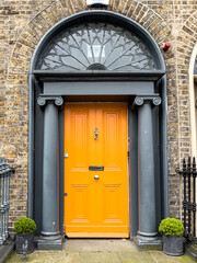 A famous orange painted Georgian door in Dublin, Ireland
