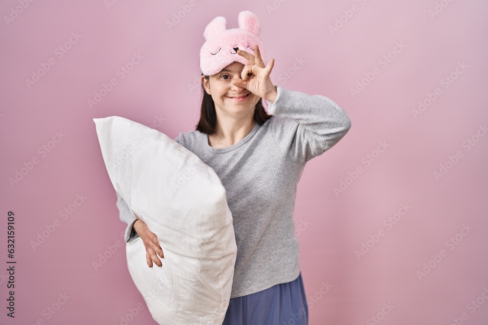 Sticker woman with down syndrome wearing sleeping mask hugging pillow doing ok gesture with hand smiling, ey